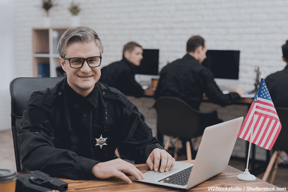 Police Officer at computer