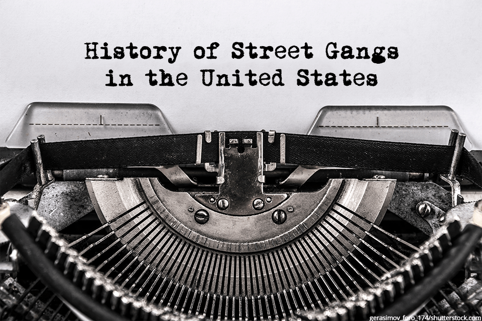 a typewriter with "history of street gangs in the united states" typed on the paper