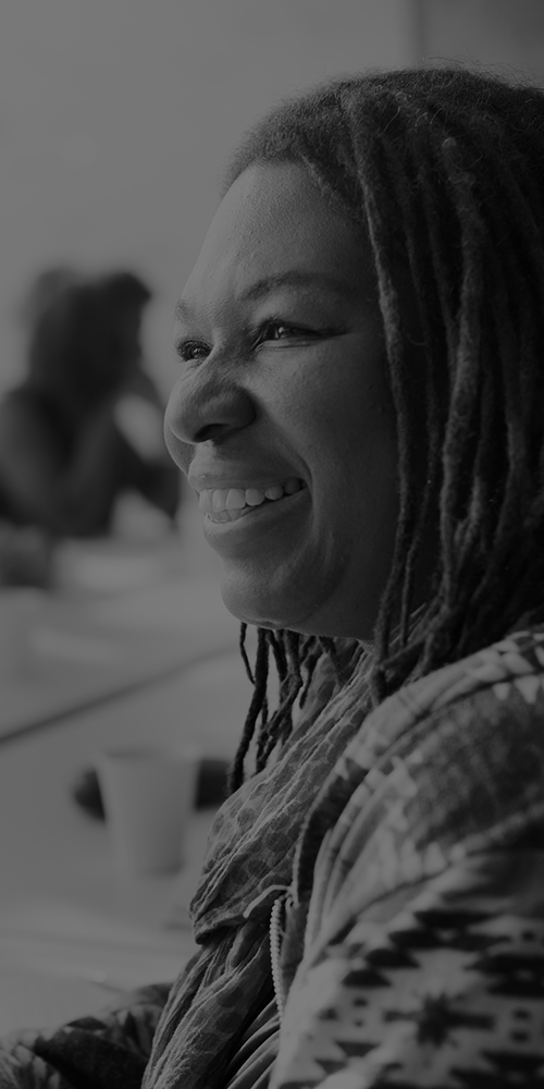a head and shoulders view of a woman smiling