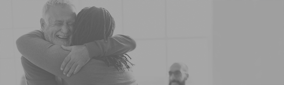 two people hugging each other