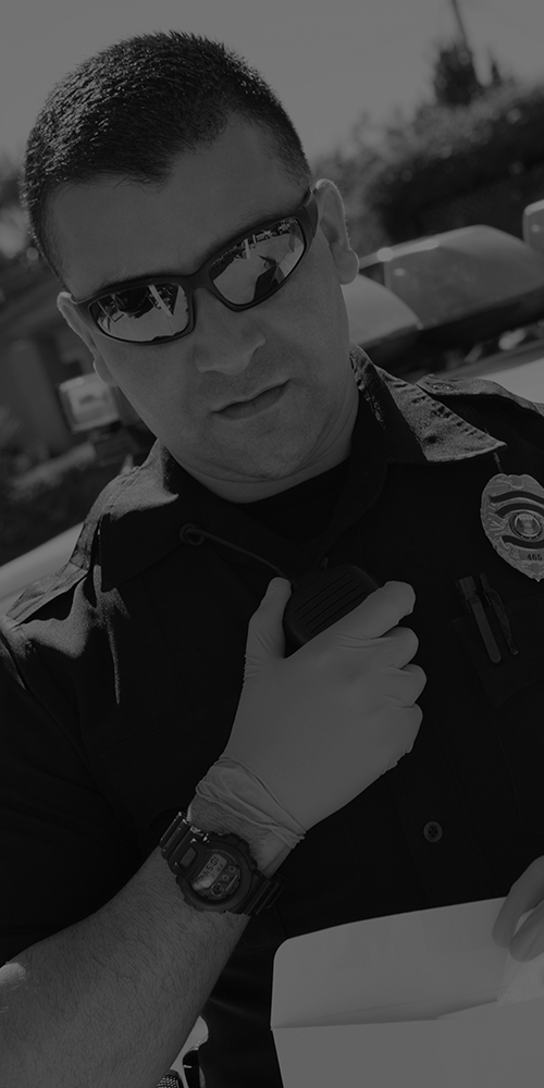 a police officer communicating through a walkie-talkie