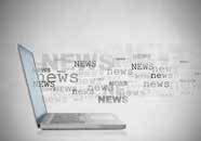 a laptop with the word "news" printed multiple times in a cloud around it