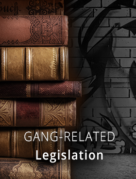 The words "Gang-Related Legislation" and a stack of leather-bound books against a graffiti background