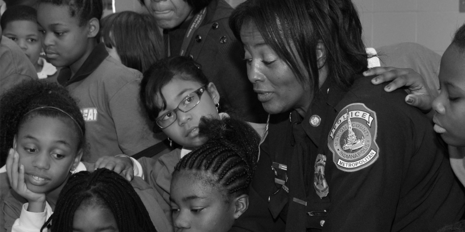 a police officer with a group of children