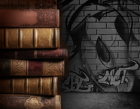 a stack of leather-bound books against a graffiti background