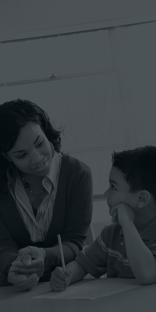 a woman helping a child with his homework