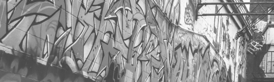 a wall covered in graffiti
