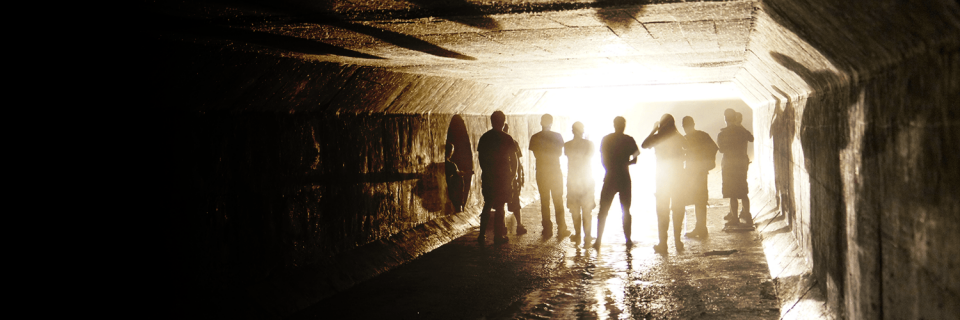 Menacing people in a tunnel