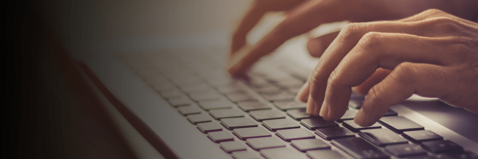 Fingers typing on a keyboard