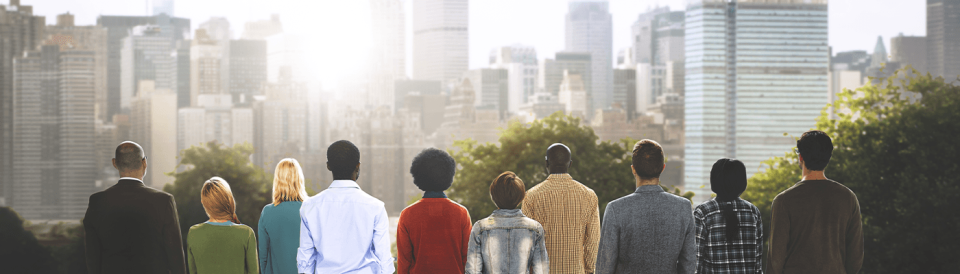 a group of people standing side by side looking at the city